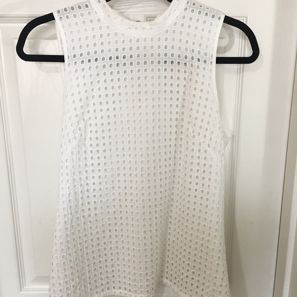Eyelet sleeveless blouse.